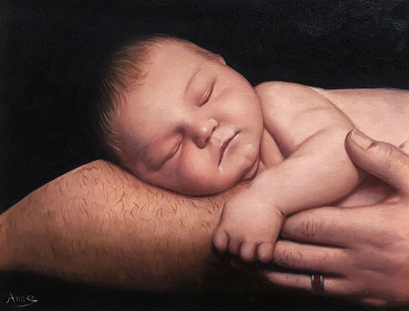 a custom oil painting of a newborn sleeping in hands