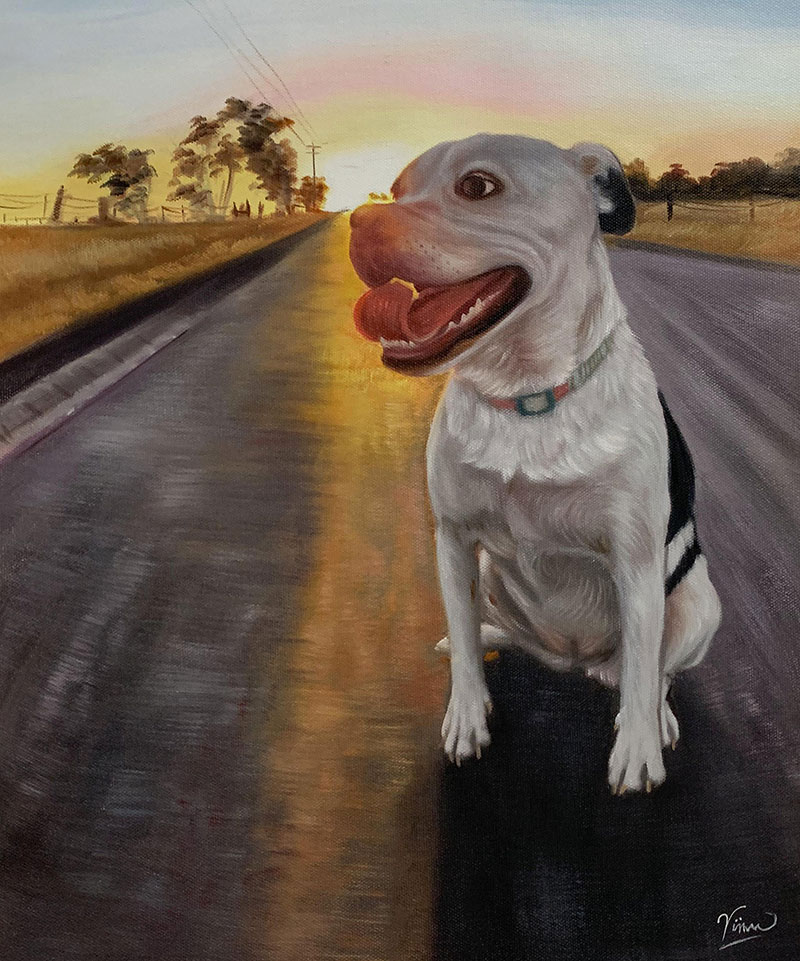 Painting of a happy dog sitting on a road at sunset.