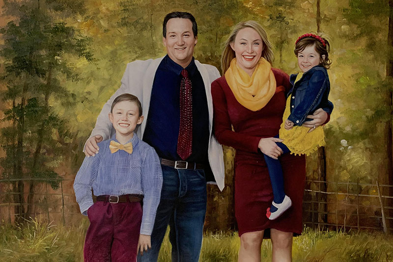 Family portrait painting, parents and two children in autumnal setting.