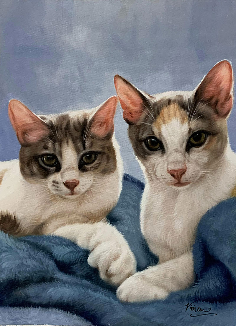 Painting of two kittens nestled together under a blue blanket.