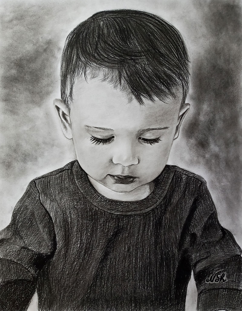 Beautiful handmade charcoal portrait of a boy
