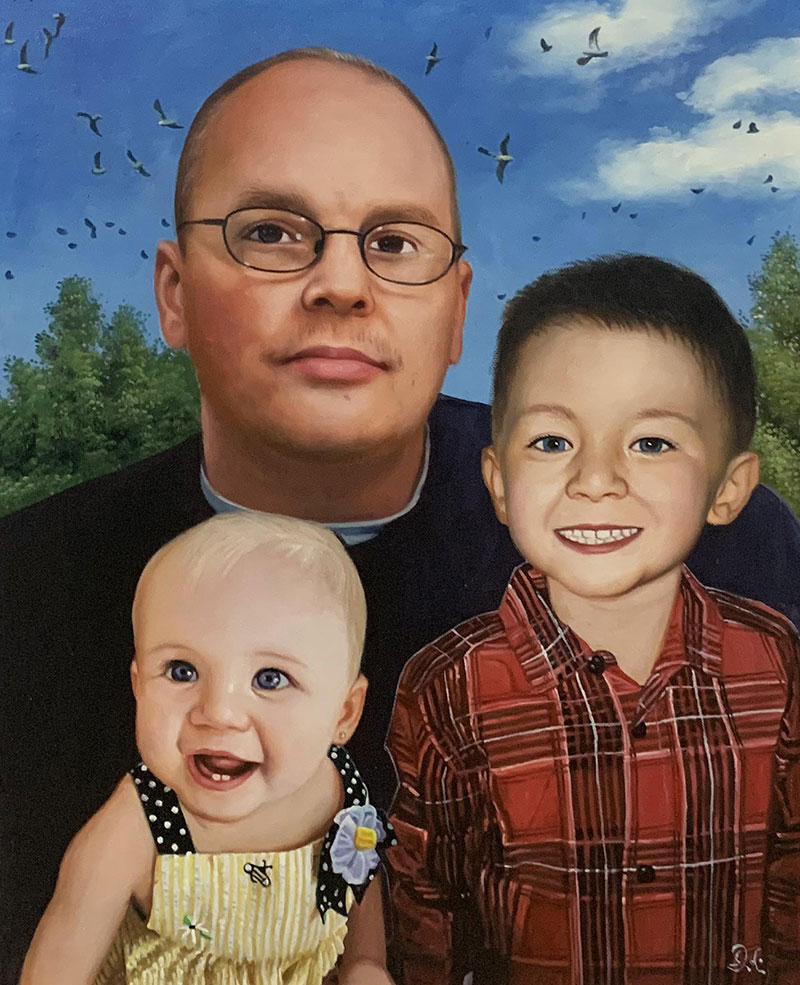 Portrait of a father with his two young children, birds flying overhead.