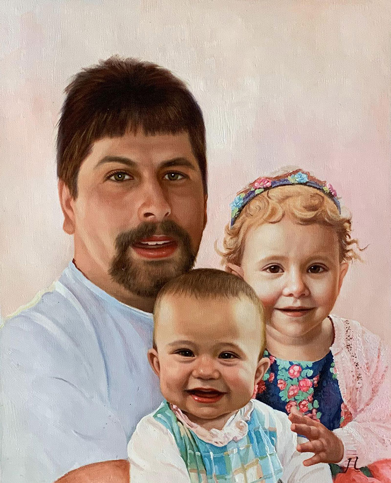 Portrait of a father with his two young children.