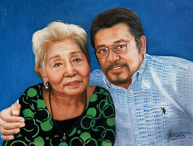 Painted portrait of an elderly woman and man.
