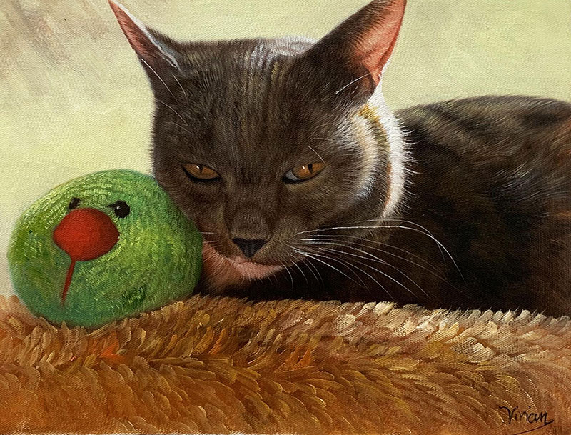 Painting of a gray cat next to a green toy bird on a brown surface.