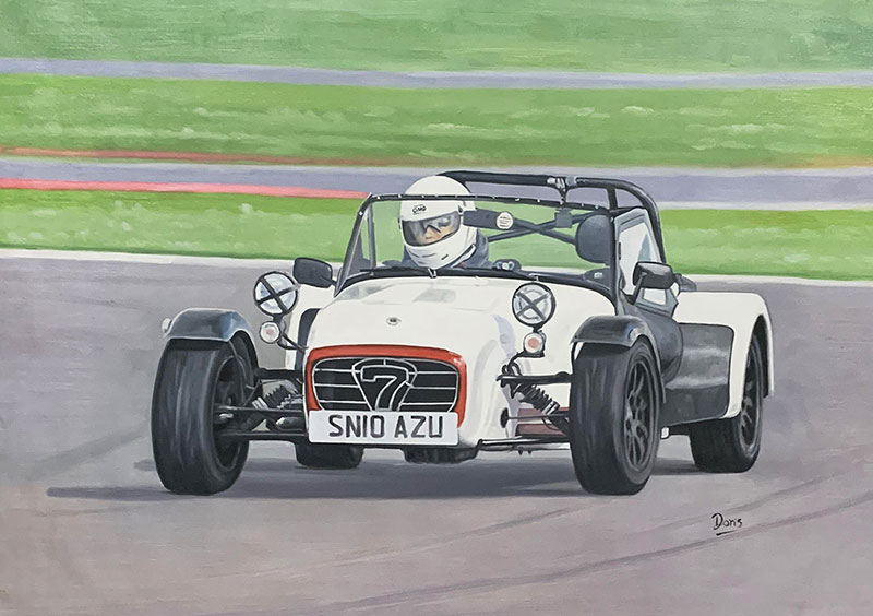 Painting of a white Caterham Seven race car on a track with a driver wearing a helmet.