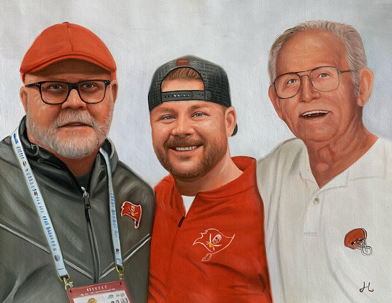 Painted portrait of three men, two wearing glasses and baseball caps, one in a red Buccaneers shirt.
