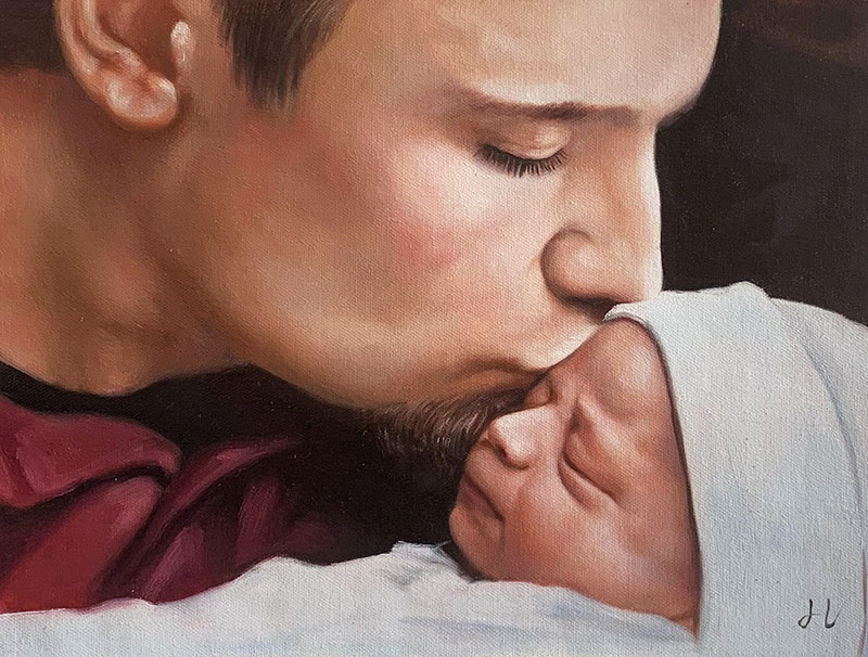Gorgeous handmade oil artwork of a father kissing a baby