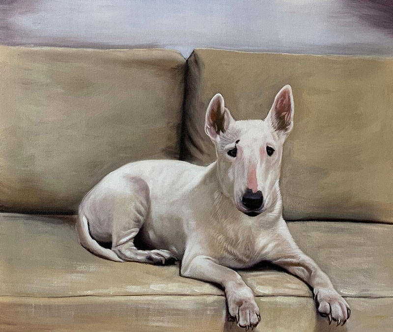 Painting of a white bull terrier lying on a tan couch