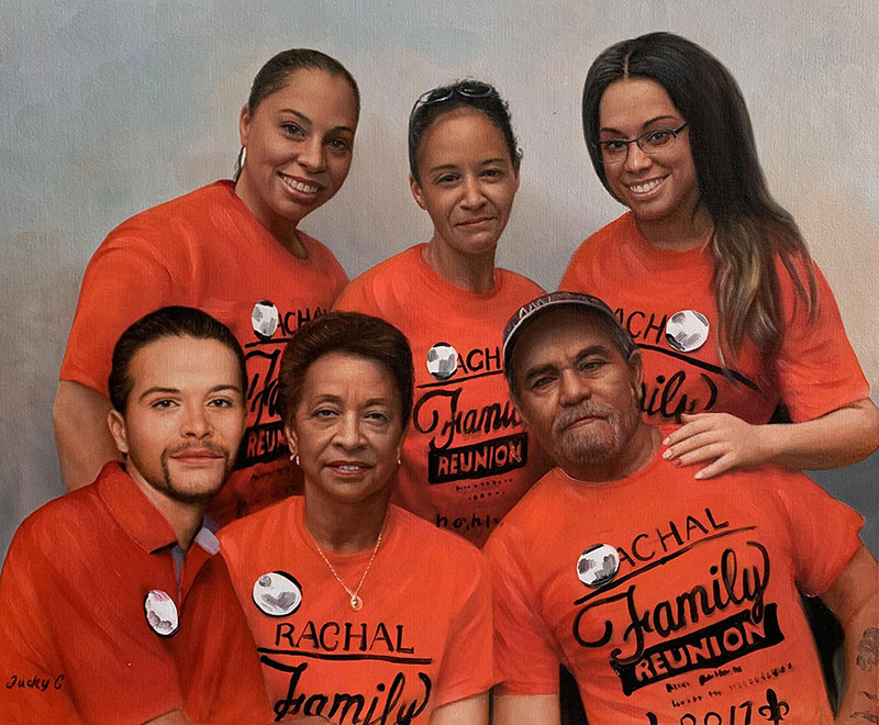 Painted portrait of six adults and one young adult wearing matching orange t-shirts that say Rachal Family Reunion 2017.