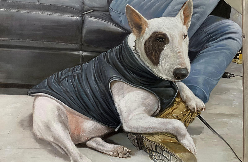 Painting of a bull terrier wearing a dark vest, resting near a person`s legs and boots.
