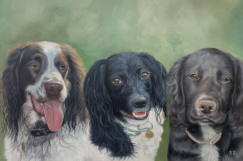 Painting of three dogs, one brown and white, two black and white.