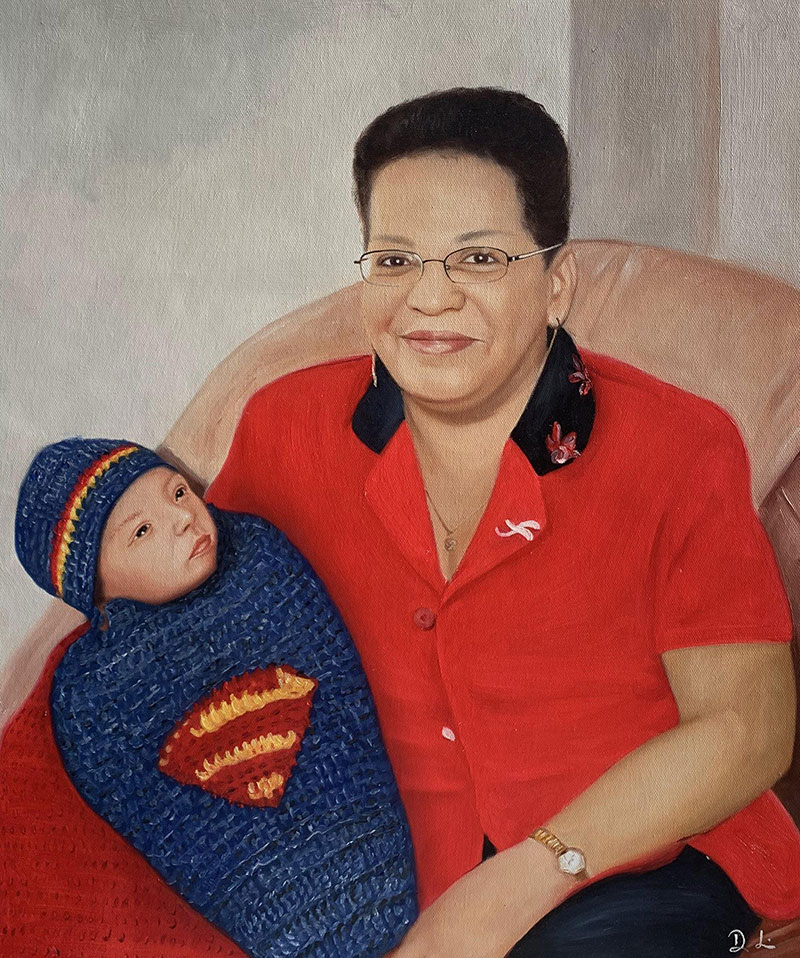 Oil painting portrait of a woman in a red shirt holding a baby wrapped in a Superman-themed blanket.