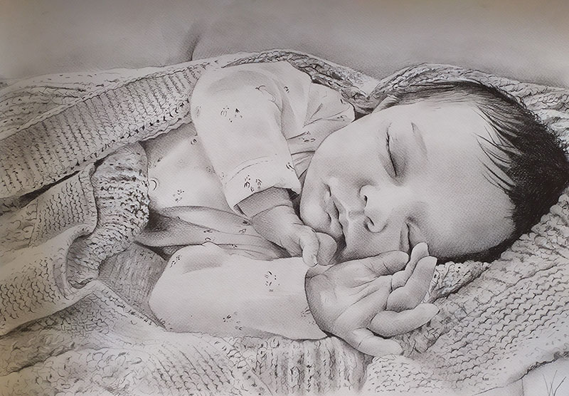 Gorgeous black pencil drawing of a sleeping baby
