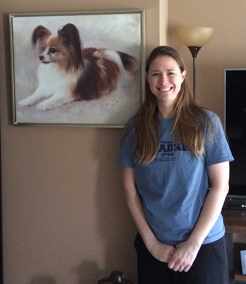 an oil painting of a little brown white spotted dog