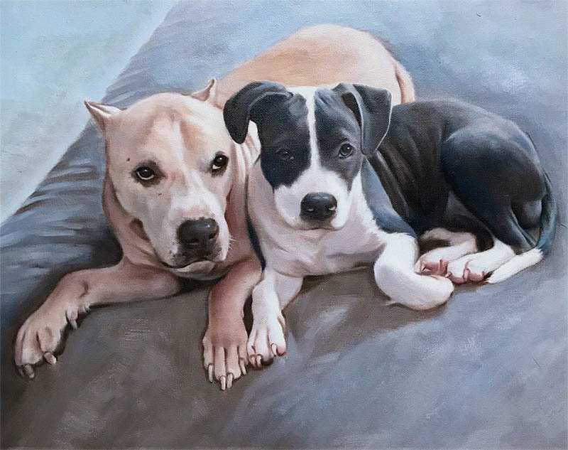 Painting of two pit bull terriers lying together on a gray surface.
