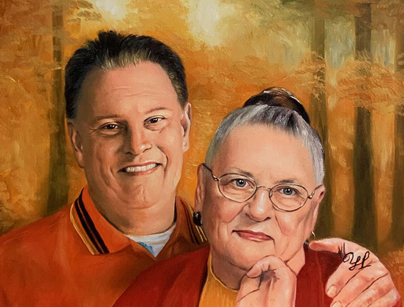 Painted portrait of a smiling man and woman in autumnal setting.