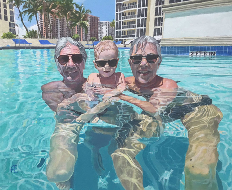 Two grandparents and a toddler in a swimming pool.