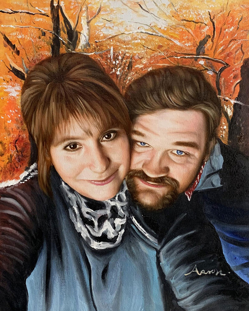 Oil painting portrait of a couple in front of an autumnal background.