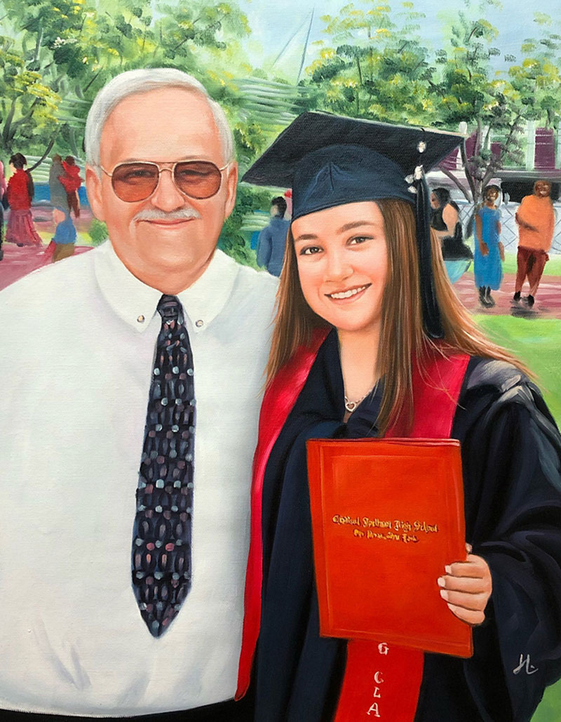 Portrait of a grandfather and his granddaughter on her graduation day.