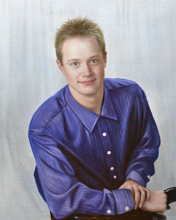 a custom oil portrait of a young man in blue shirt