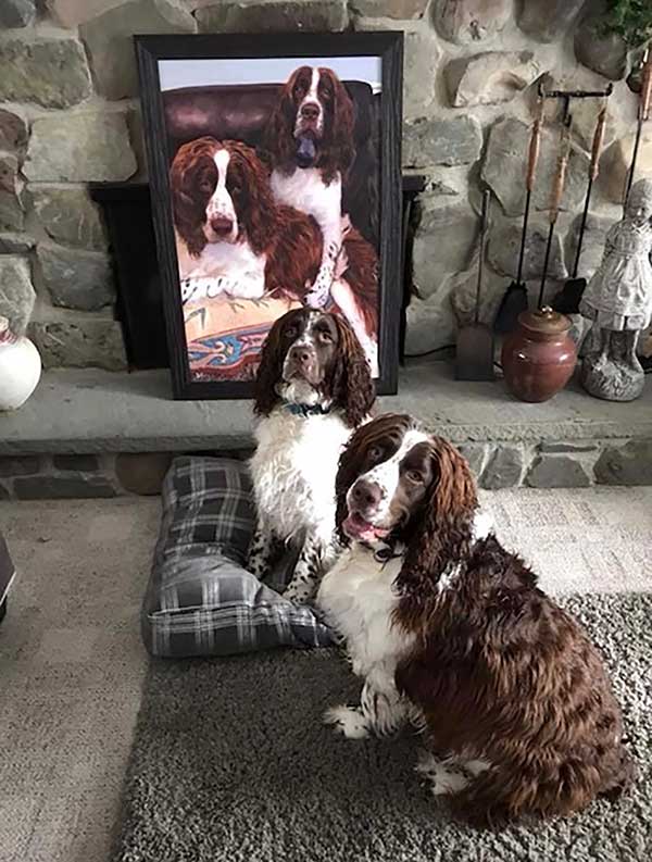 an oil painting of two black and brown dogs sitting in the sofa