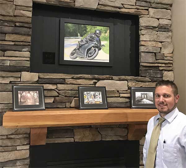 an oil painting of a man on the black bike motorbike