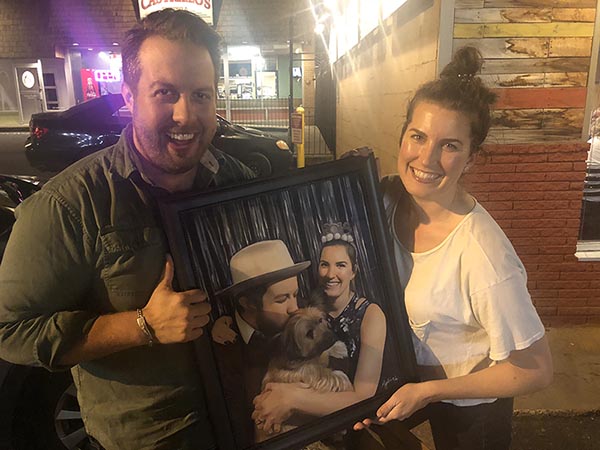 an oil painting of a couple with a dog