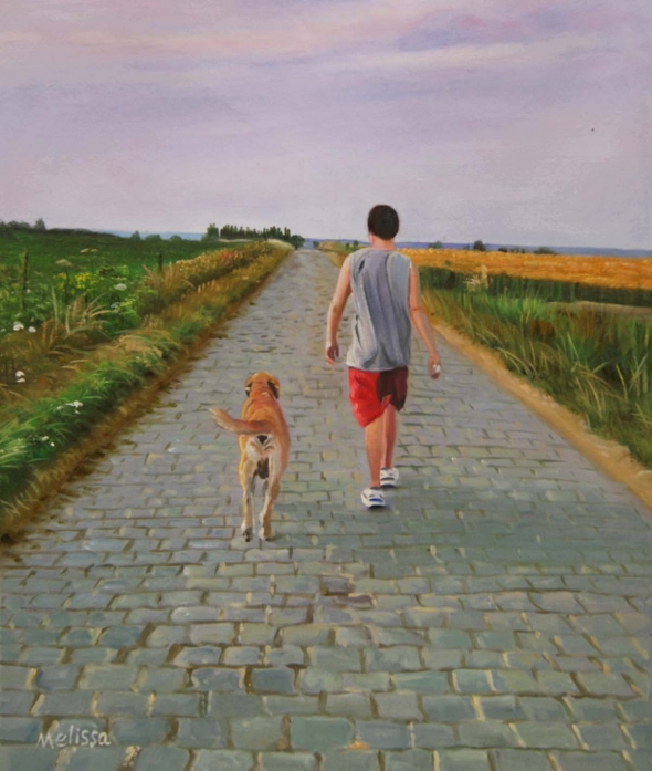 Person and dog walking down a cobblestone path.