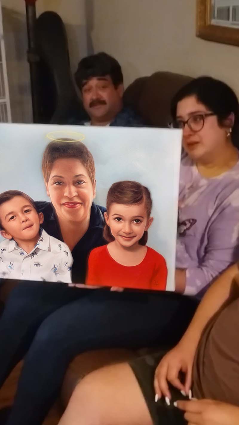 Family portrait painting displayed by two people, a man and a woman sit behind, observing.