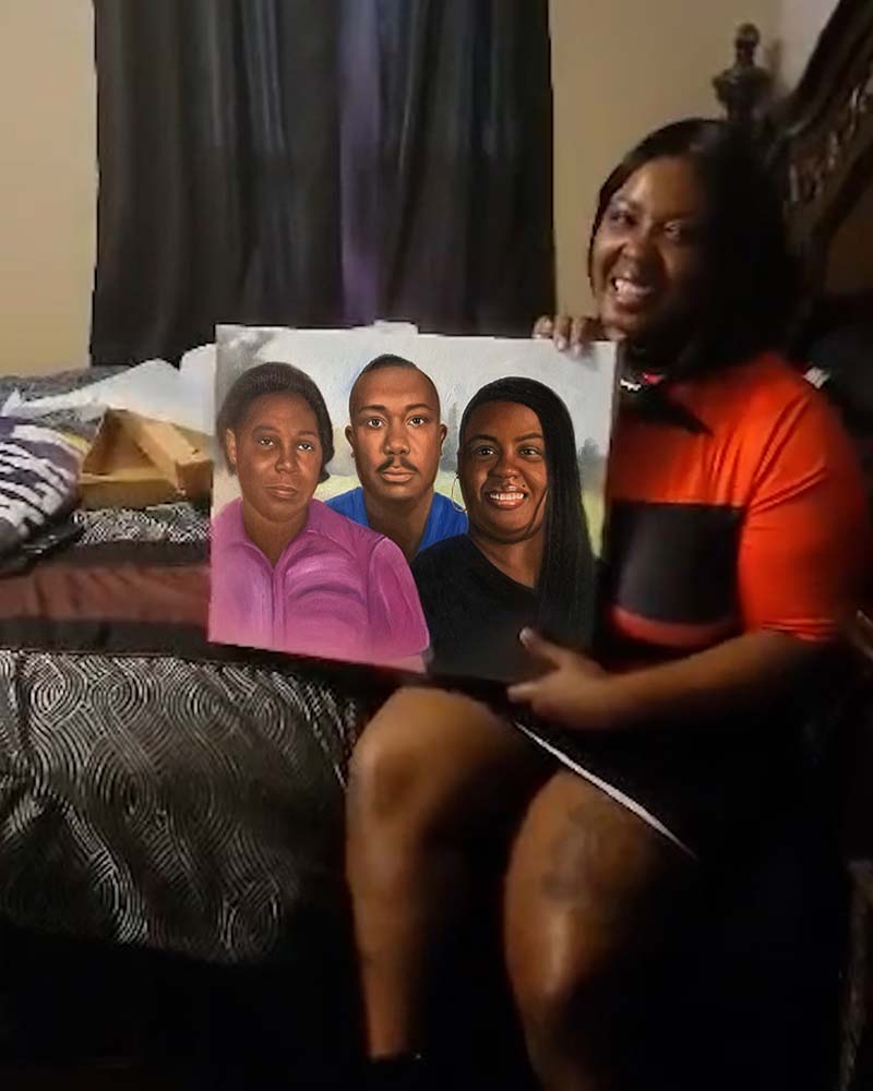 Woman holding a painted portrait of three people.