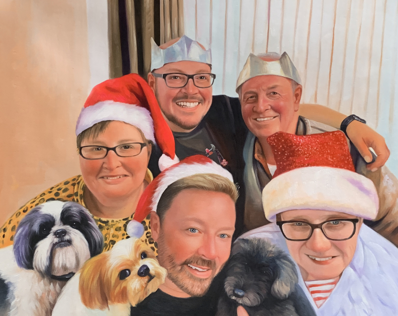 Christmas family portrait with two dogs.