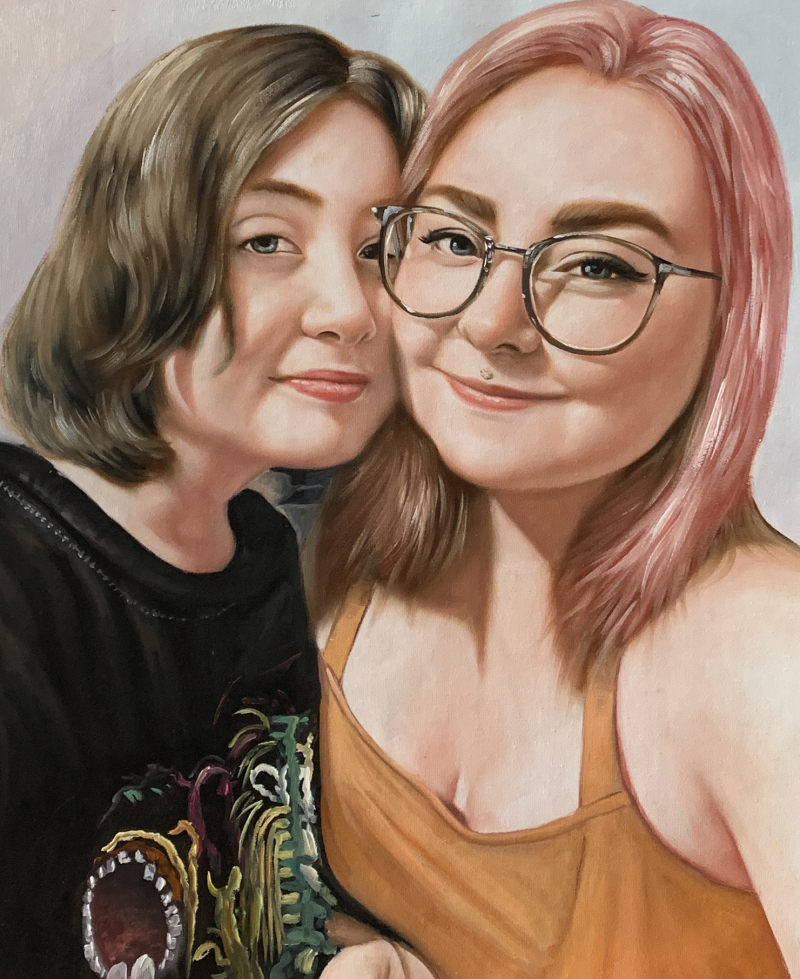 Painting of two young women, one with pink hair and glasses, the other with brown hair.