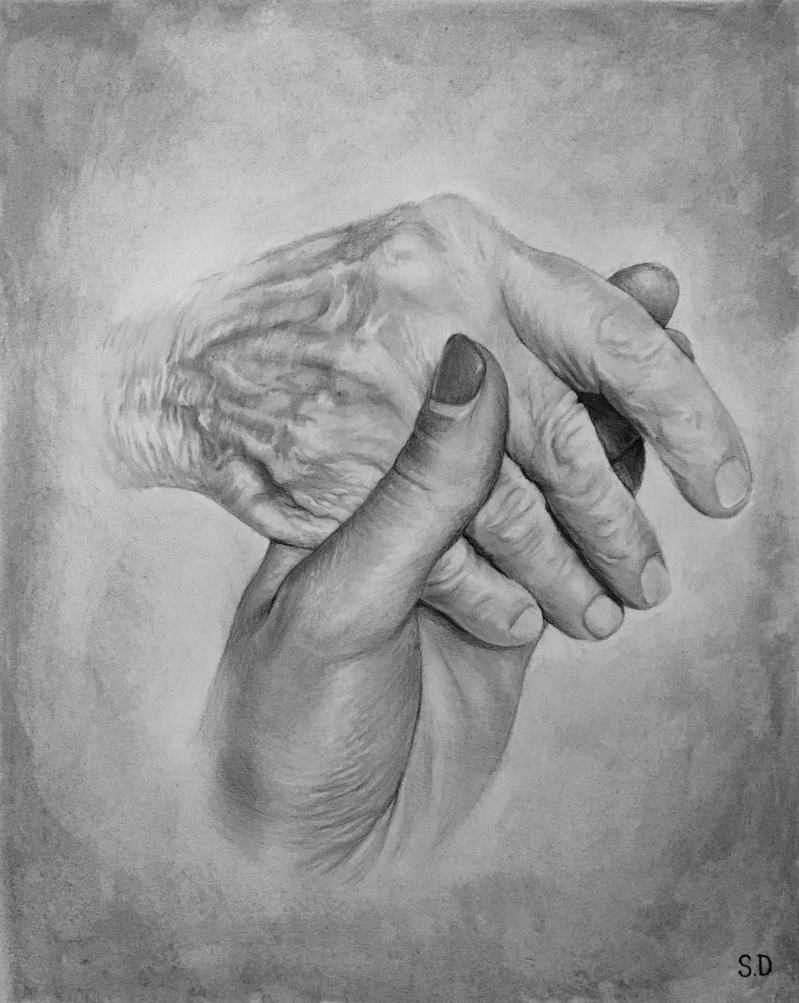 Two hands clasped together, one young, one elderly.