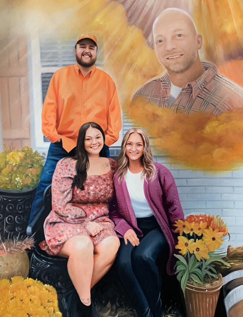 Painting of a family portrait, three people seated below a larger image of a deceased man.