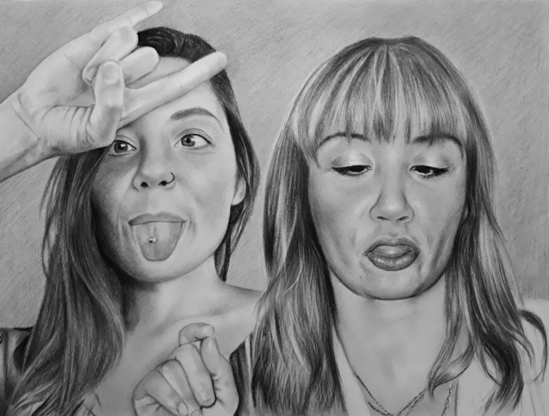 Black and white pencil sketch of two women, one making a rock-on hand gesture and sticking out her tongue, the other with her tongue sticking out slightly.