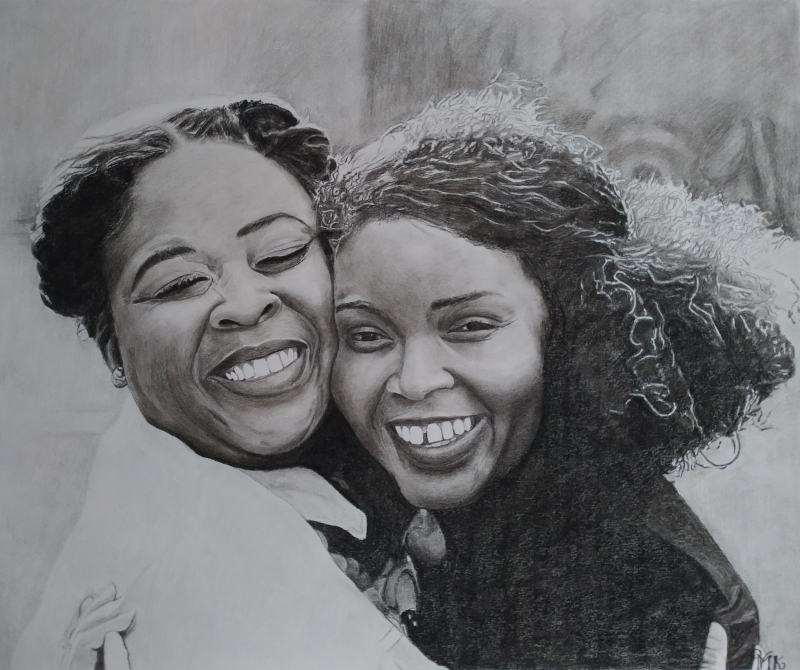 Charcoal drawing of two smiling Black women embracing.
