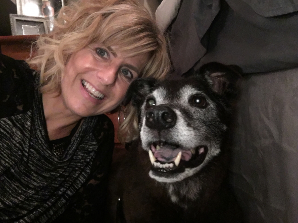 a pastel painting of an owner and her happy dog