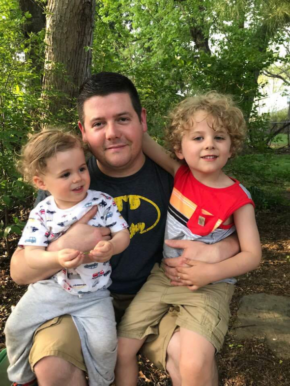 an oil painting of a father with his children
