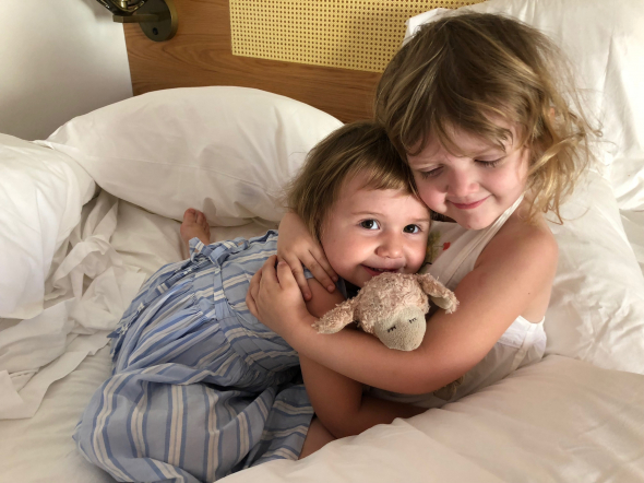 an oil painting of two kids siblings