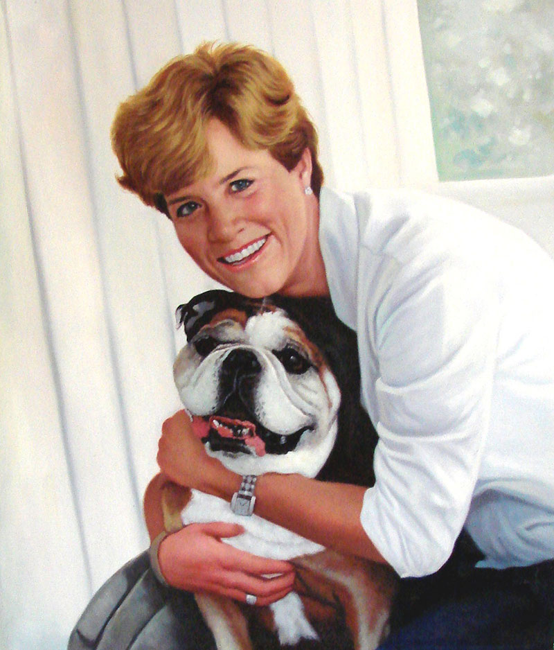 Painting of a woman hugging a bulldog.