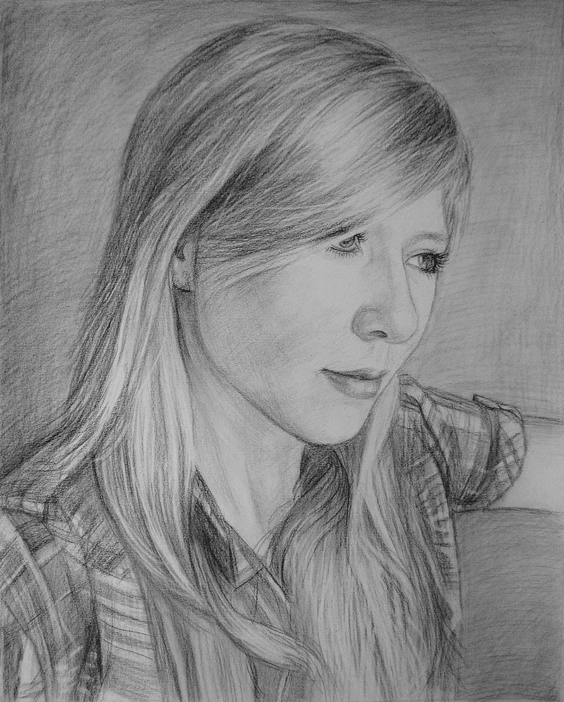 Portrait einer jungen Frau in Kohle gezeichnet
