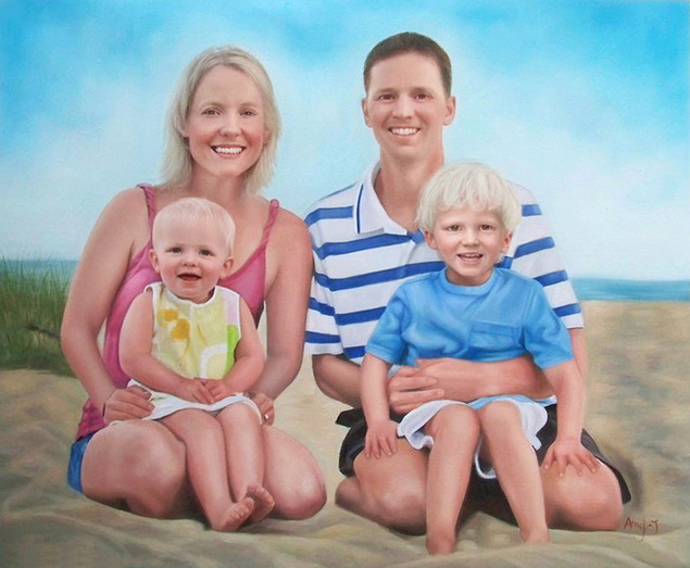 Family portrait on the beach, mom, dad, toddler, and preschooler.