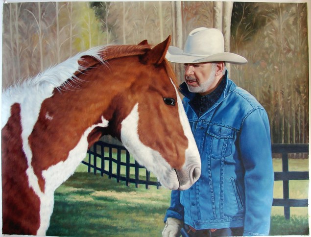 Painting of a man in a cowboy hat with a paint horse.