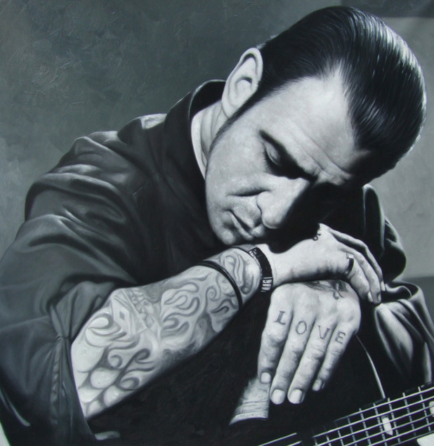 a black and white oil custom painting of a man with guitar
