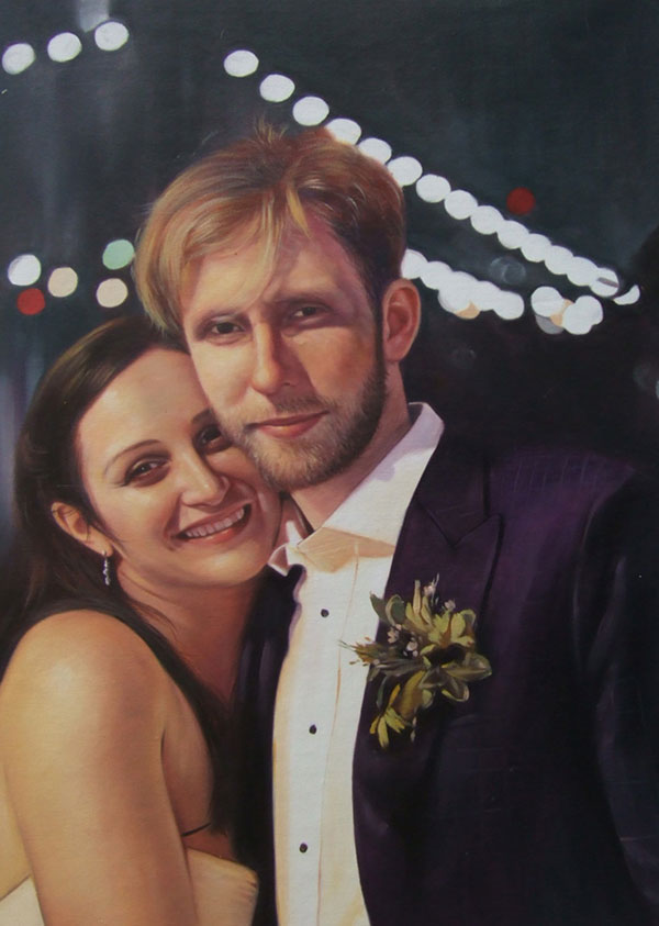 a custom oil painting of a wedding couple hugging at night