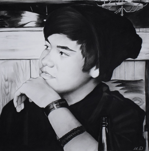 custom charcoal profile portrait of a man in a beanie